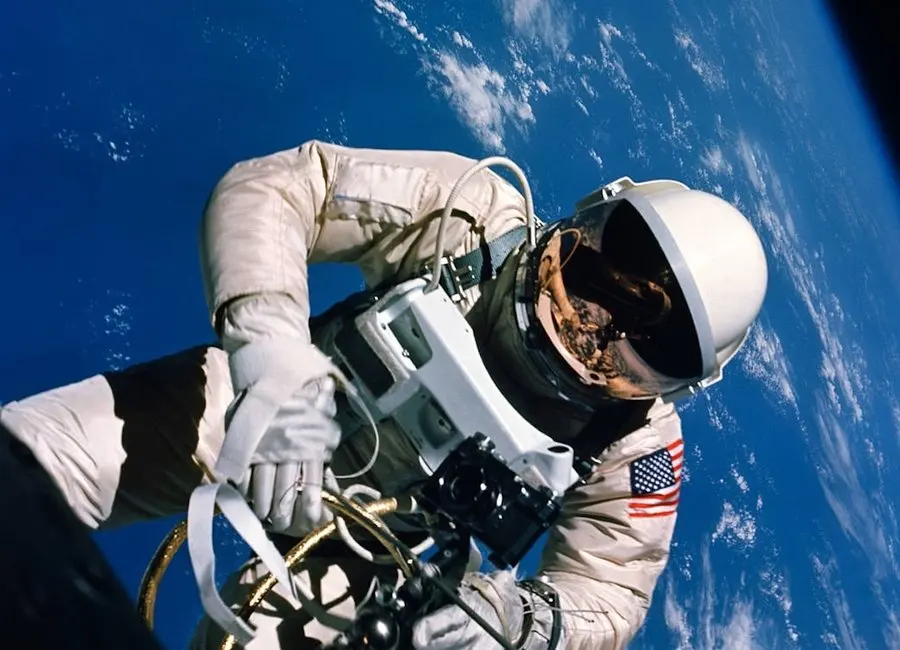 An astronaut floating above Earth in space