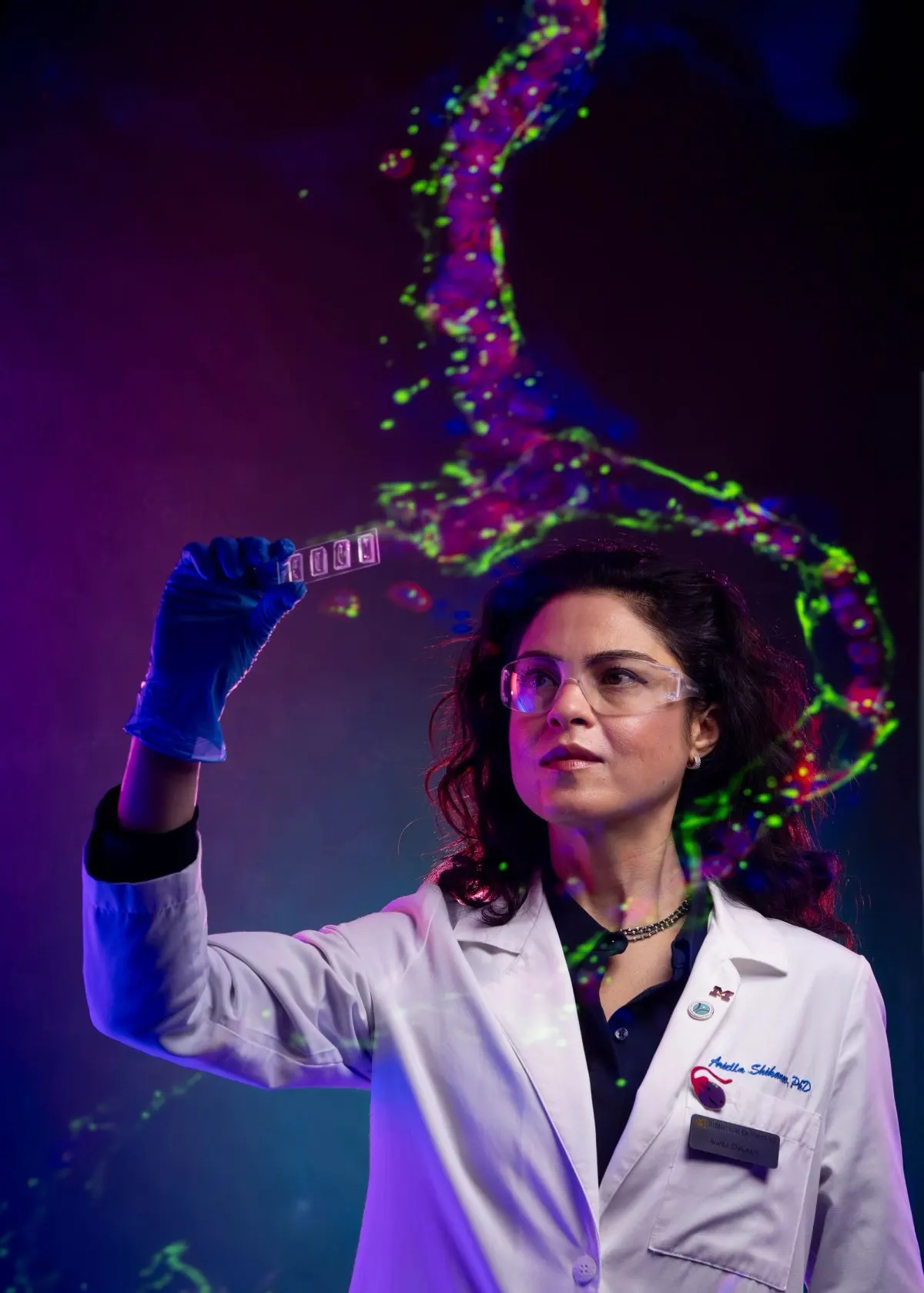 Ariella Shikanov holds up a set of artificial ovaries
