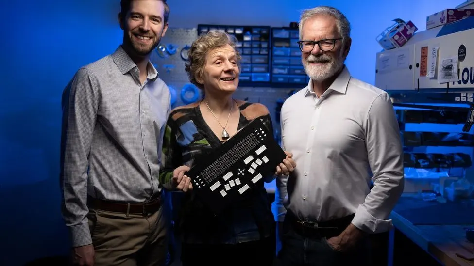 Alex Russomanno, Sile O’Modhrain, and Brent Gillespie with the NewHaptics multiline braille and tactile graphics display