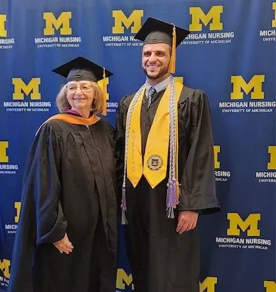 Joshua Truchan in a cap and gown at the U-M School of Nursing's commencement