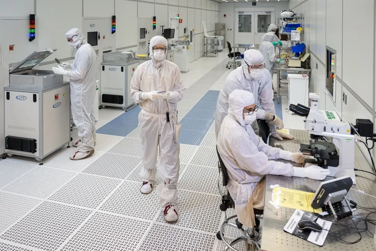 Workers inside the Lurie Nanofabrication Facility (LNF), a state-of-the-art semiconductor and nanotechnology cleanroom