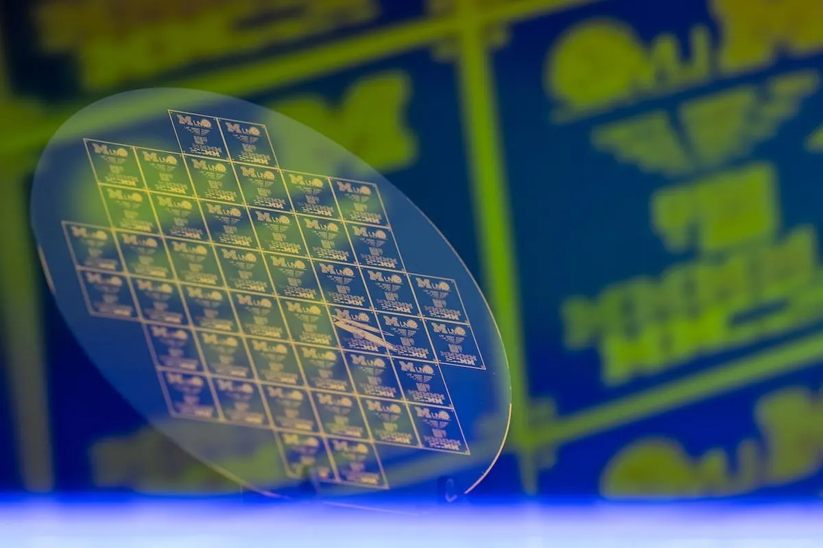 a semiconductor silicon wafer patterned with multiple integrated circuits (microchips)