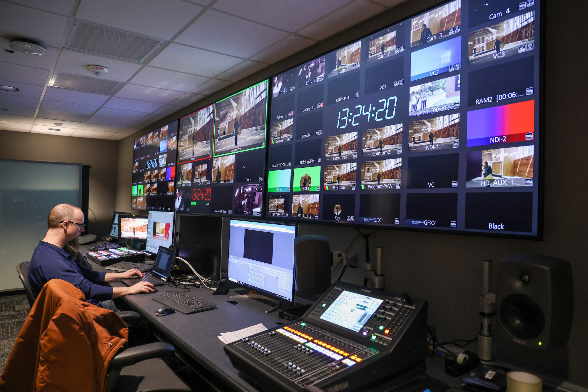 Eric Schreffler, XR developer at the Center for Academic Innovation, works in the XR studio control room.